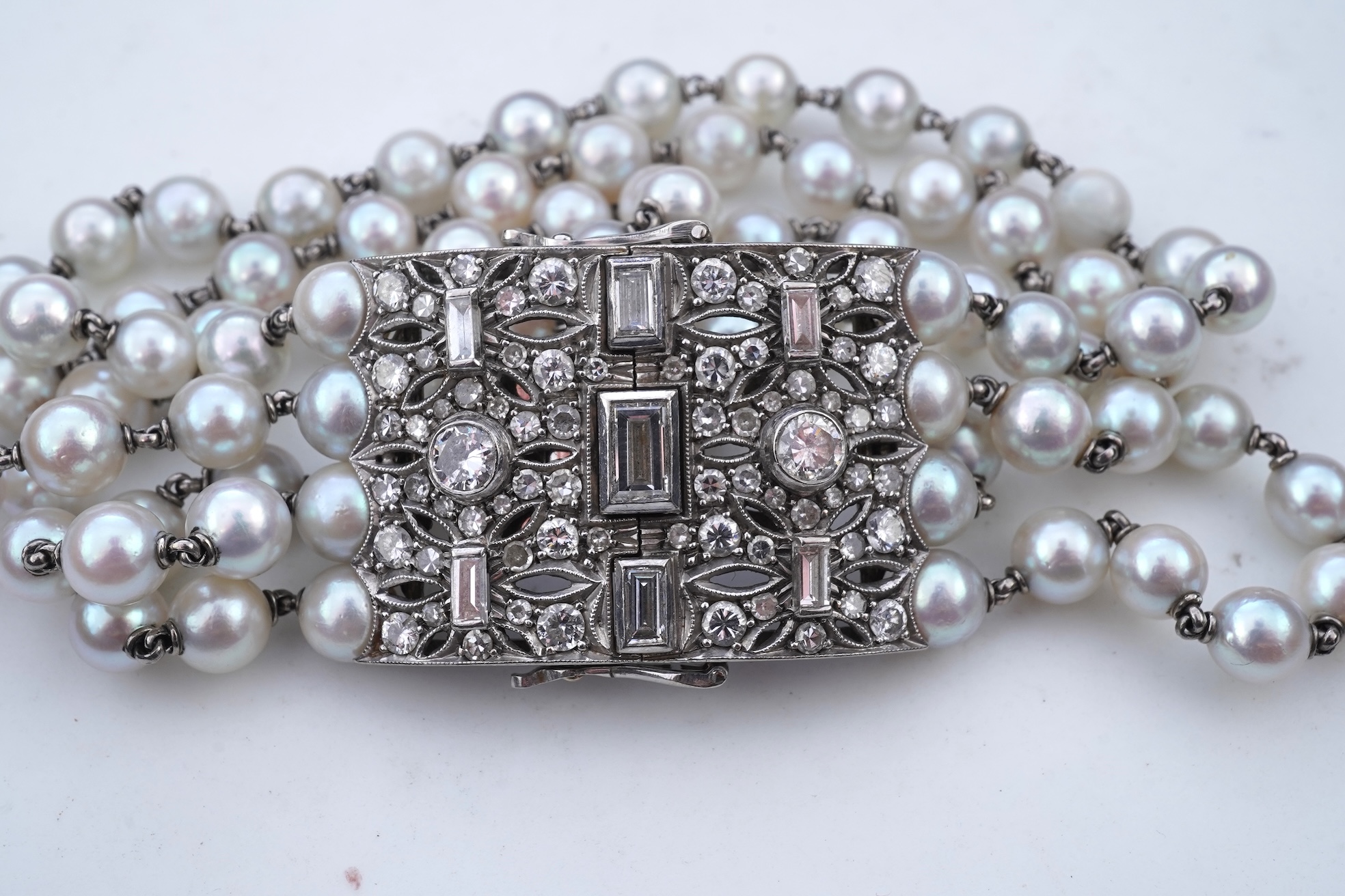 A cultured pearl and diamond bracelet